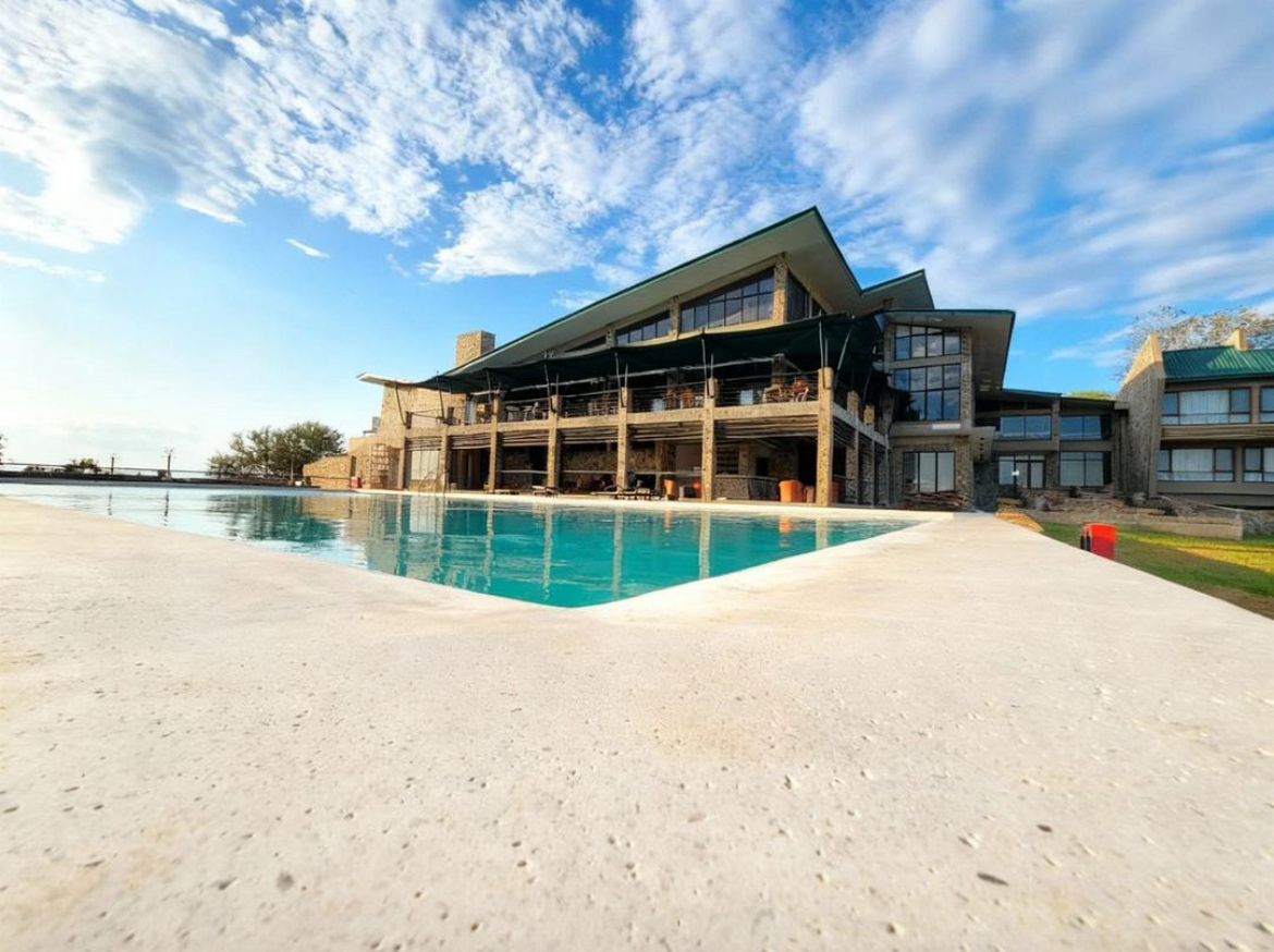 Pool and sandy beach area